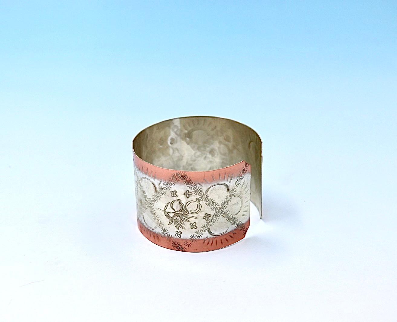 copper bracelet with pomegranates, partly silver-plated.