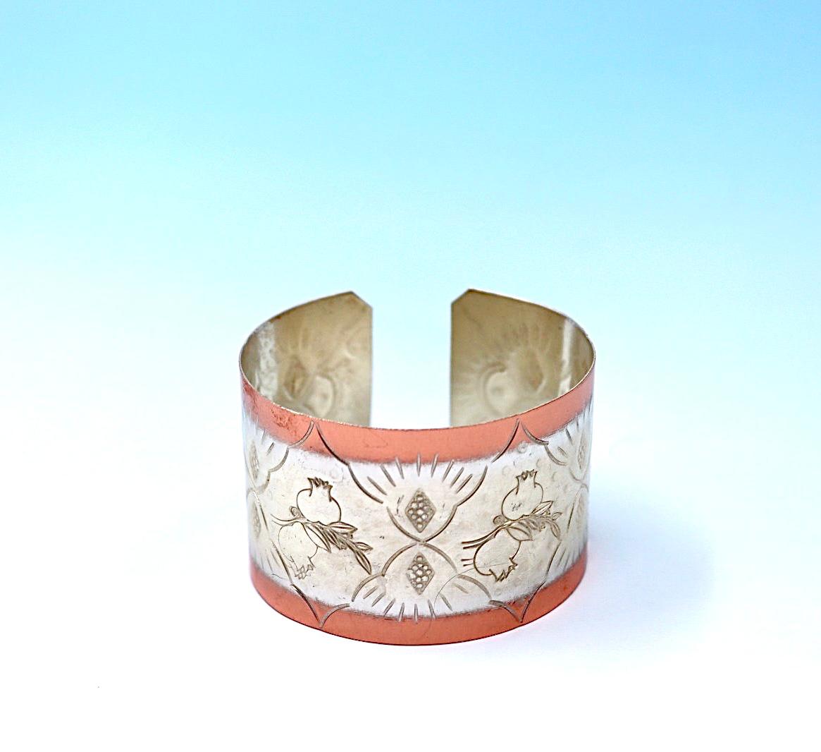 copper bracelet with pomegranates, partly silver-plated.