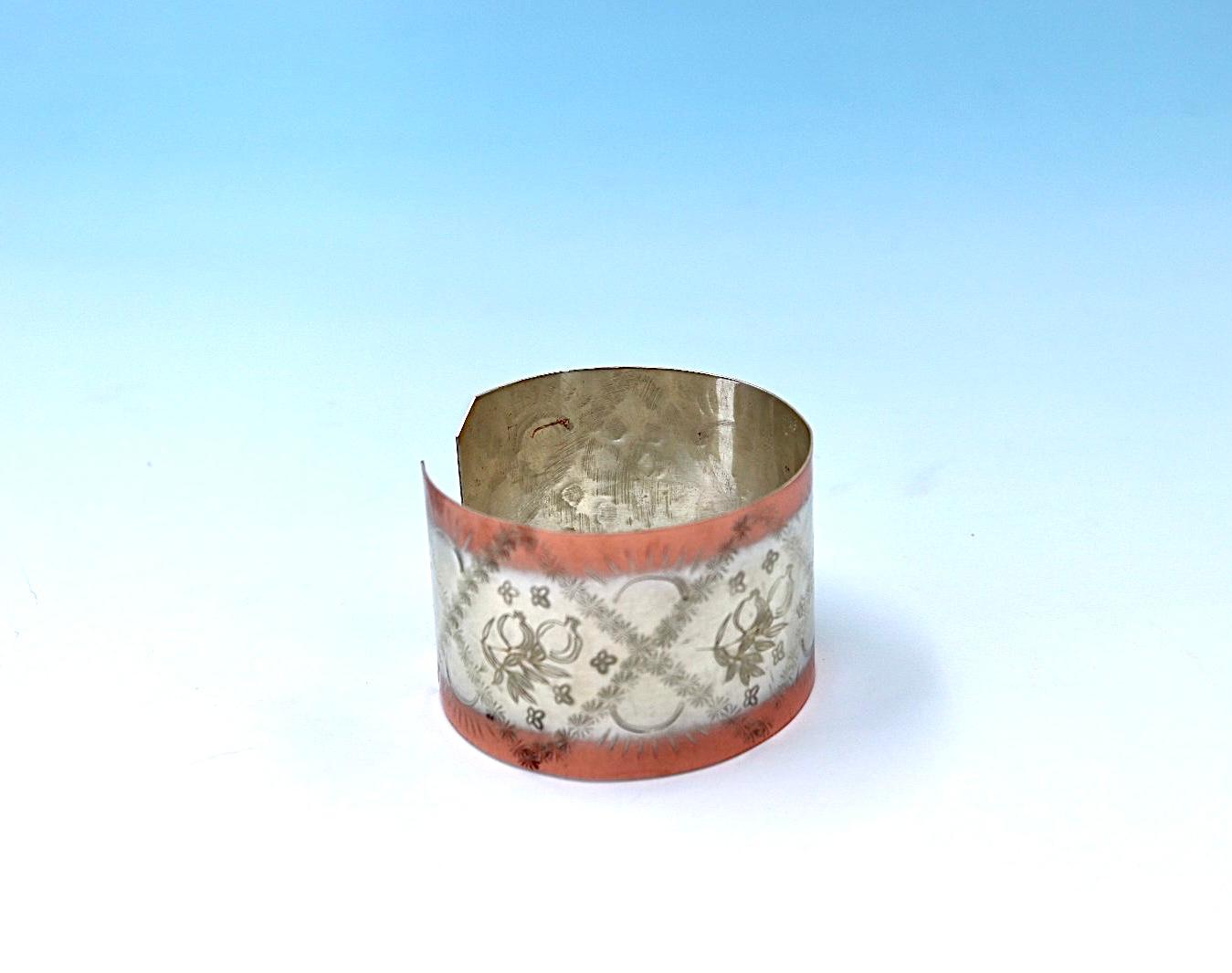 copper bracelet with pomegranates, partly silver-plated.