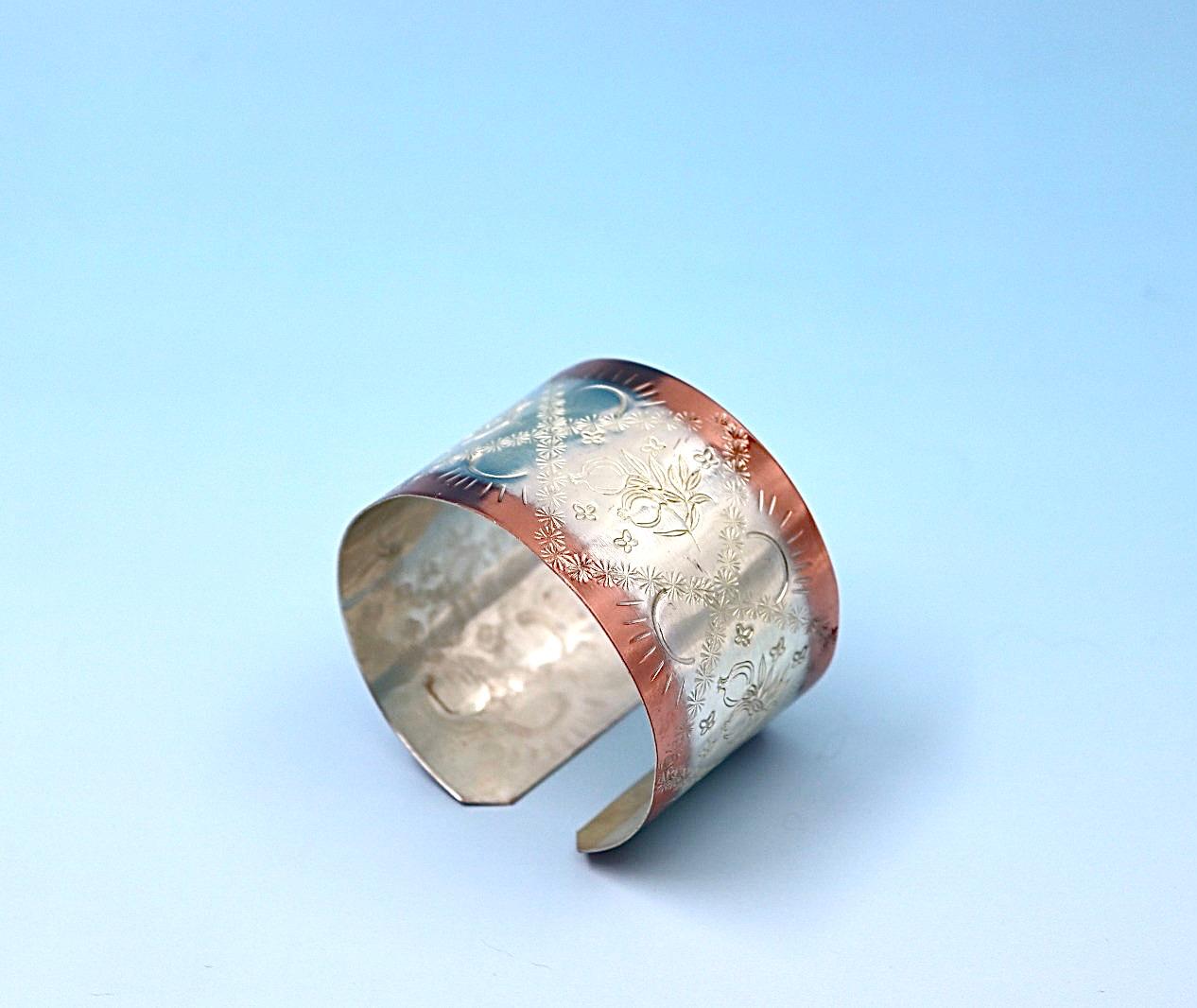 copper bracelet with pomegranates, partly silver-plated.