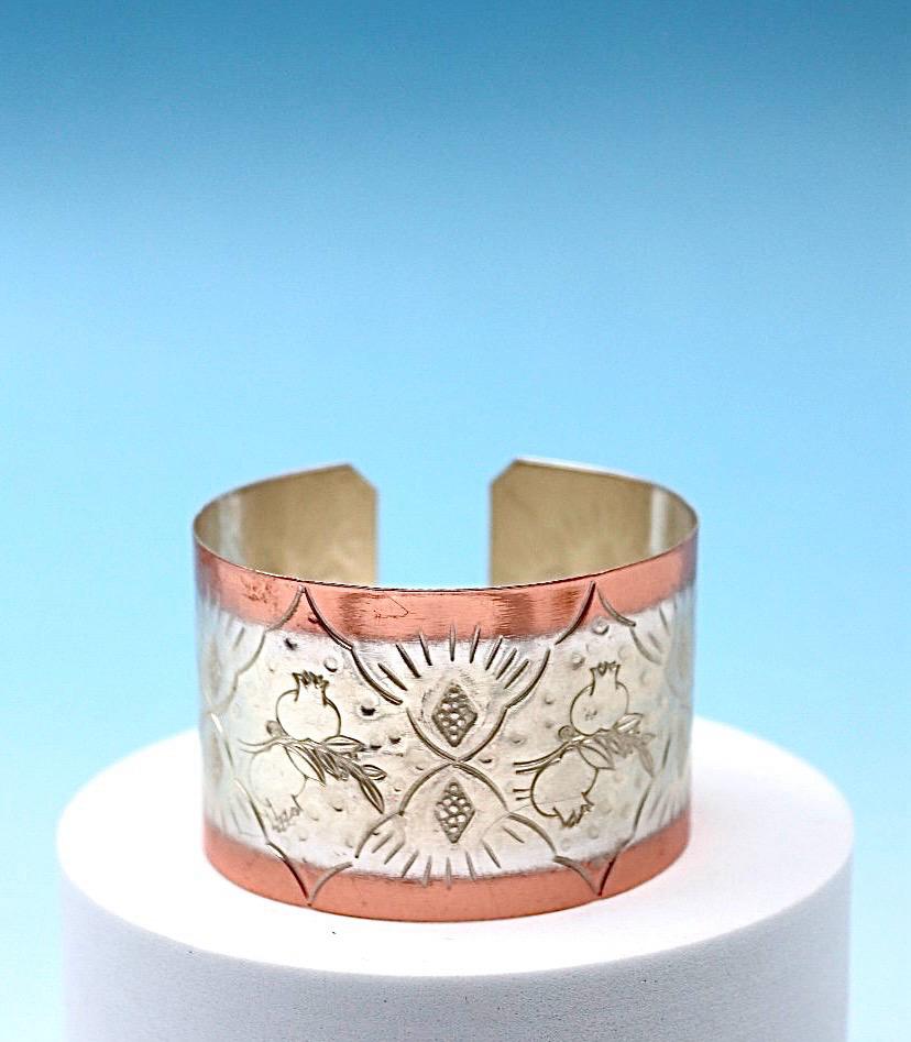 copper bracelet with pomegranates, partly silver-plated.