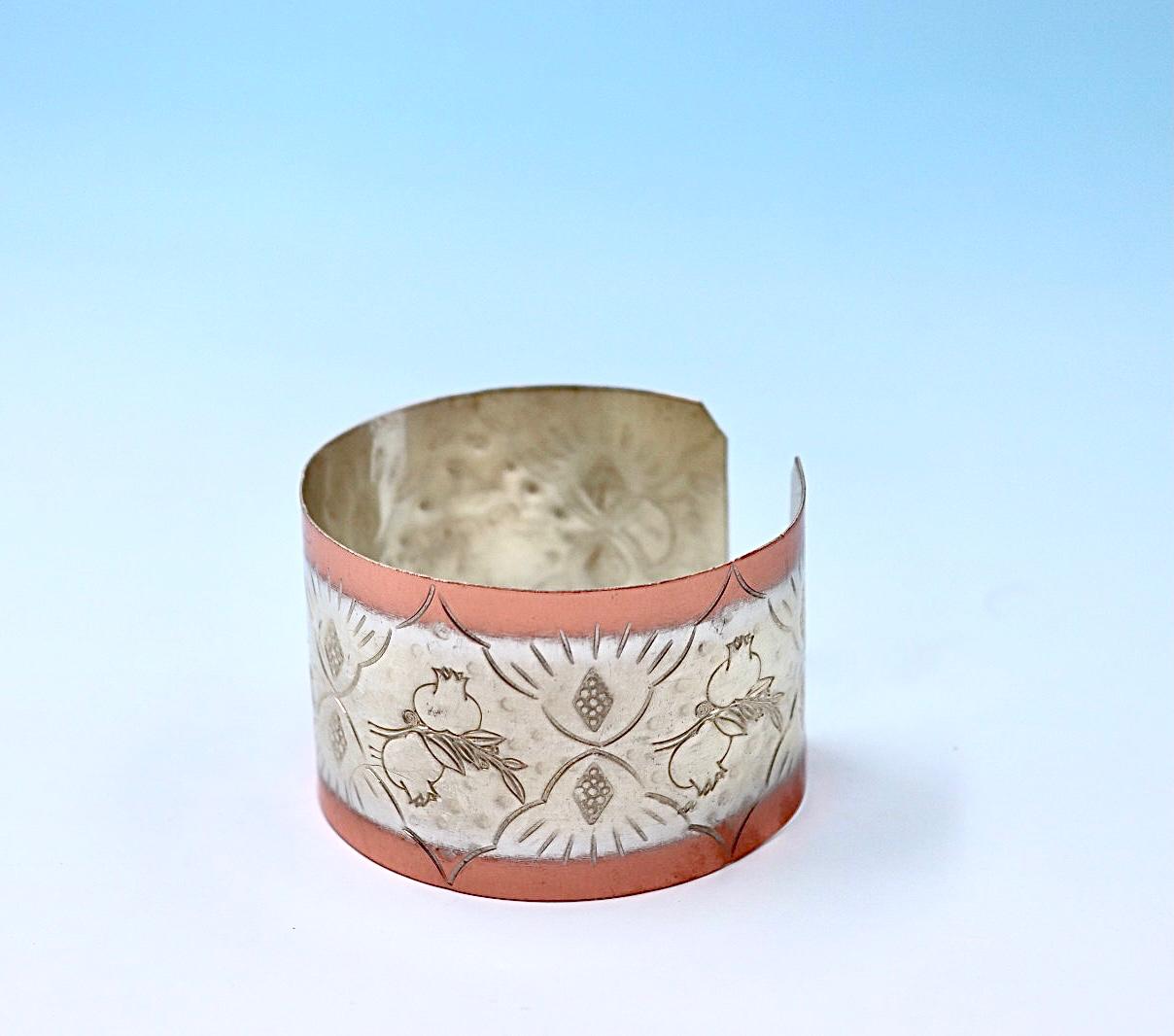 copper bracelet with pomegranates, partly silver-plated.