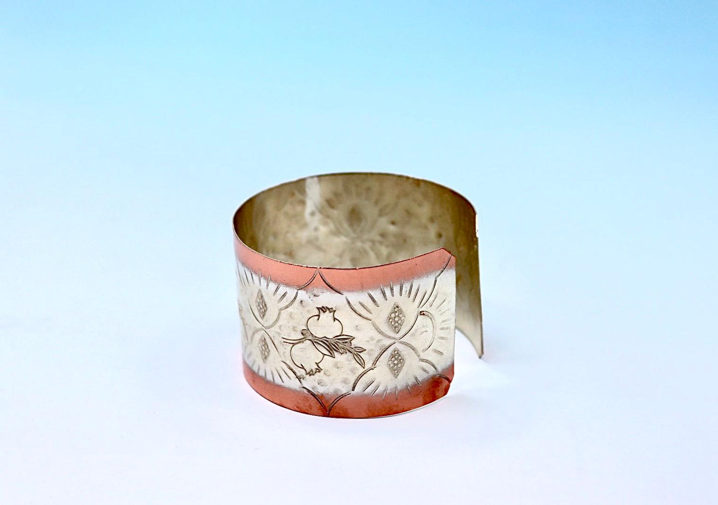 copper bracelet with pomegranates, partly silver-plated.