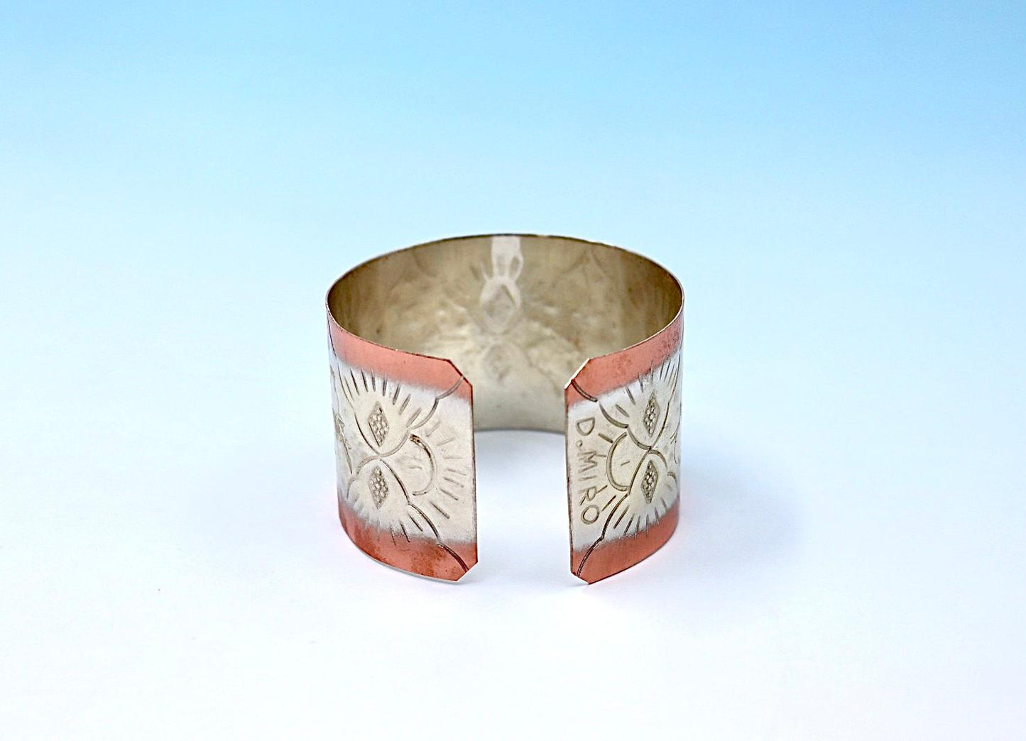 copper bracelet with pomegranates, partly silver-plated.