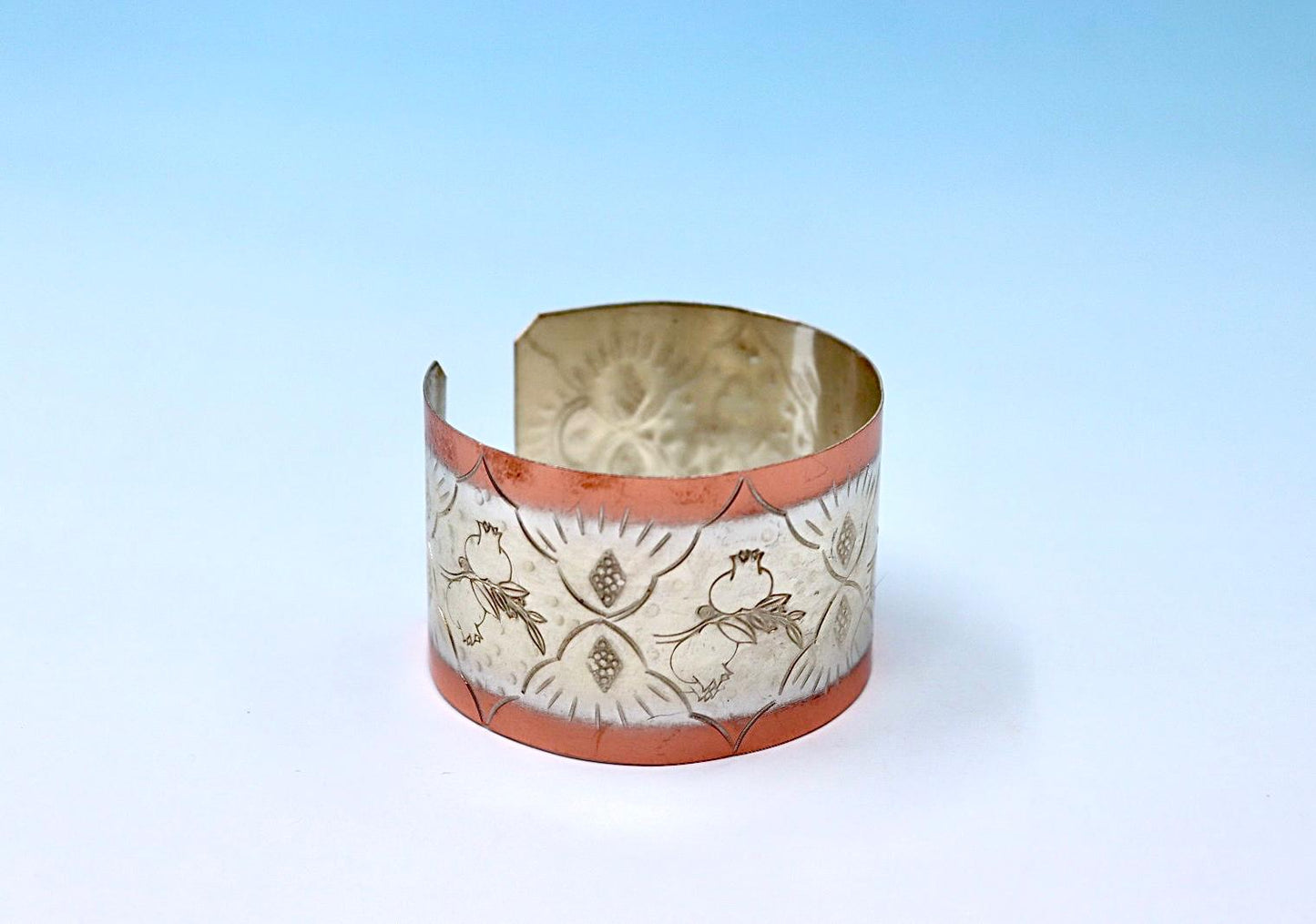 copper bracelet with pomegranates, partly silver-plated.