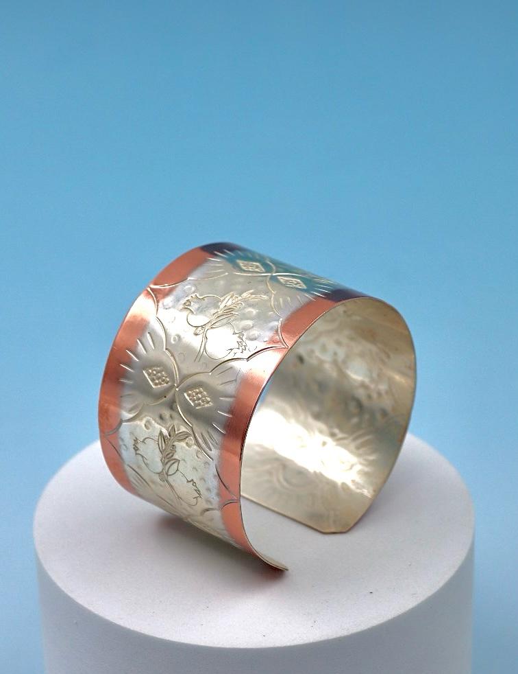 copper bracelet with pomegranates, partly silver-plated.