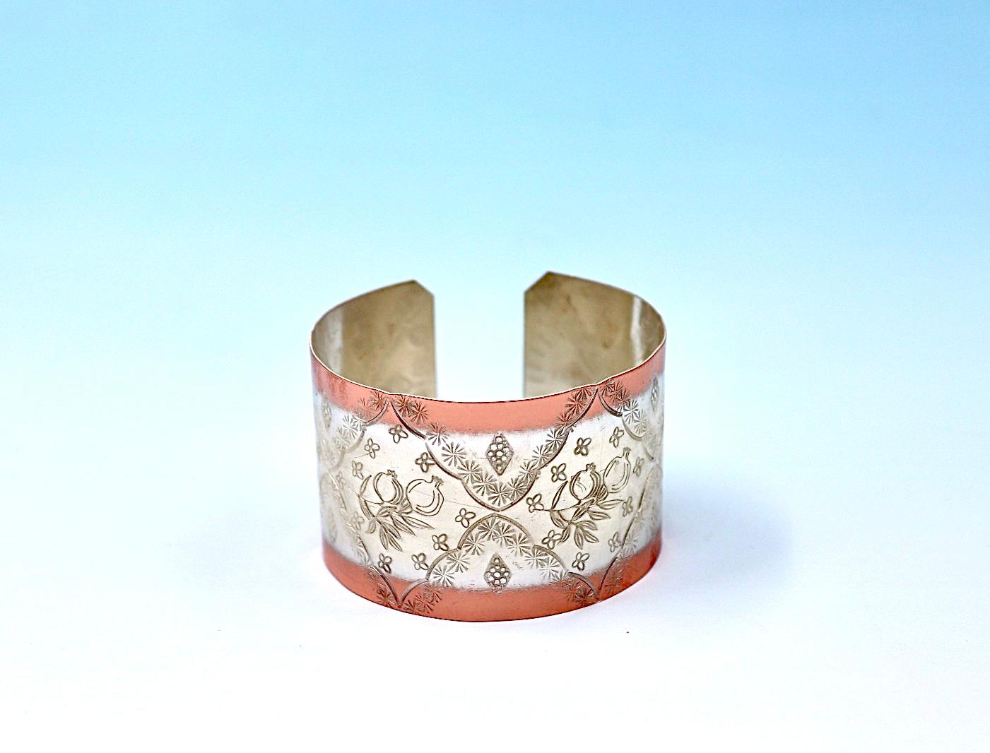 copper bracelet with pomegranates, partly silver-plated.