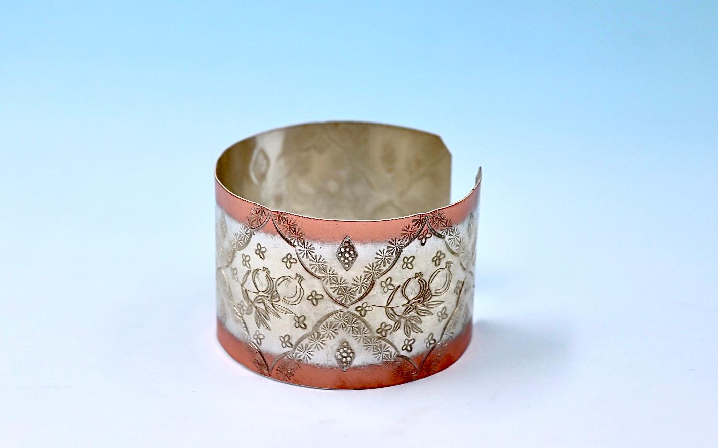 copper bracelet with pomegranates, partly silver-plated.