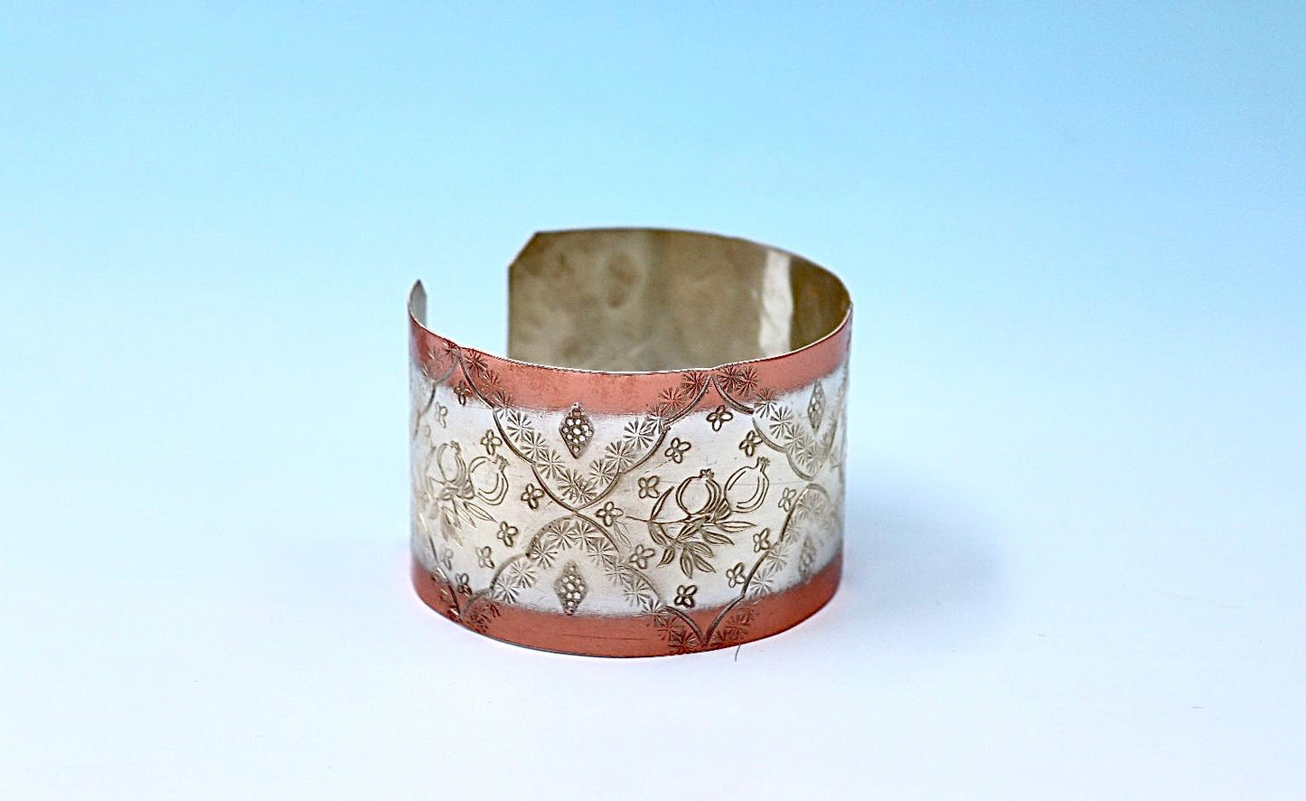 copper bracelet with pomegranates, partly silver-plated.