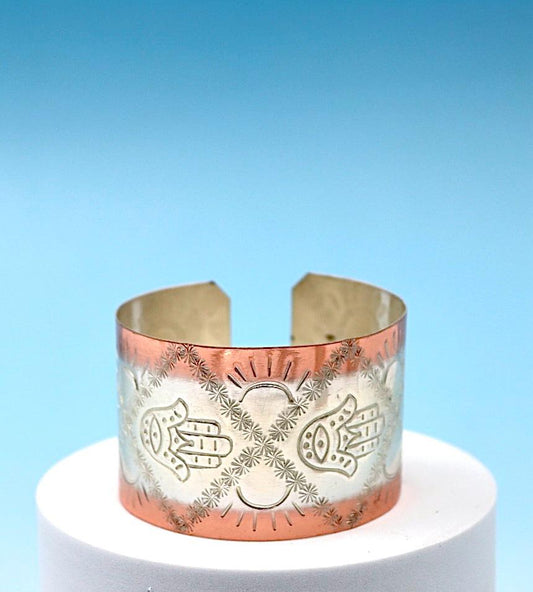 copper bracelet with Hamsa, partly silver plated.