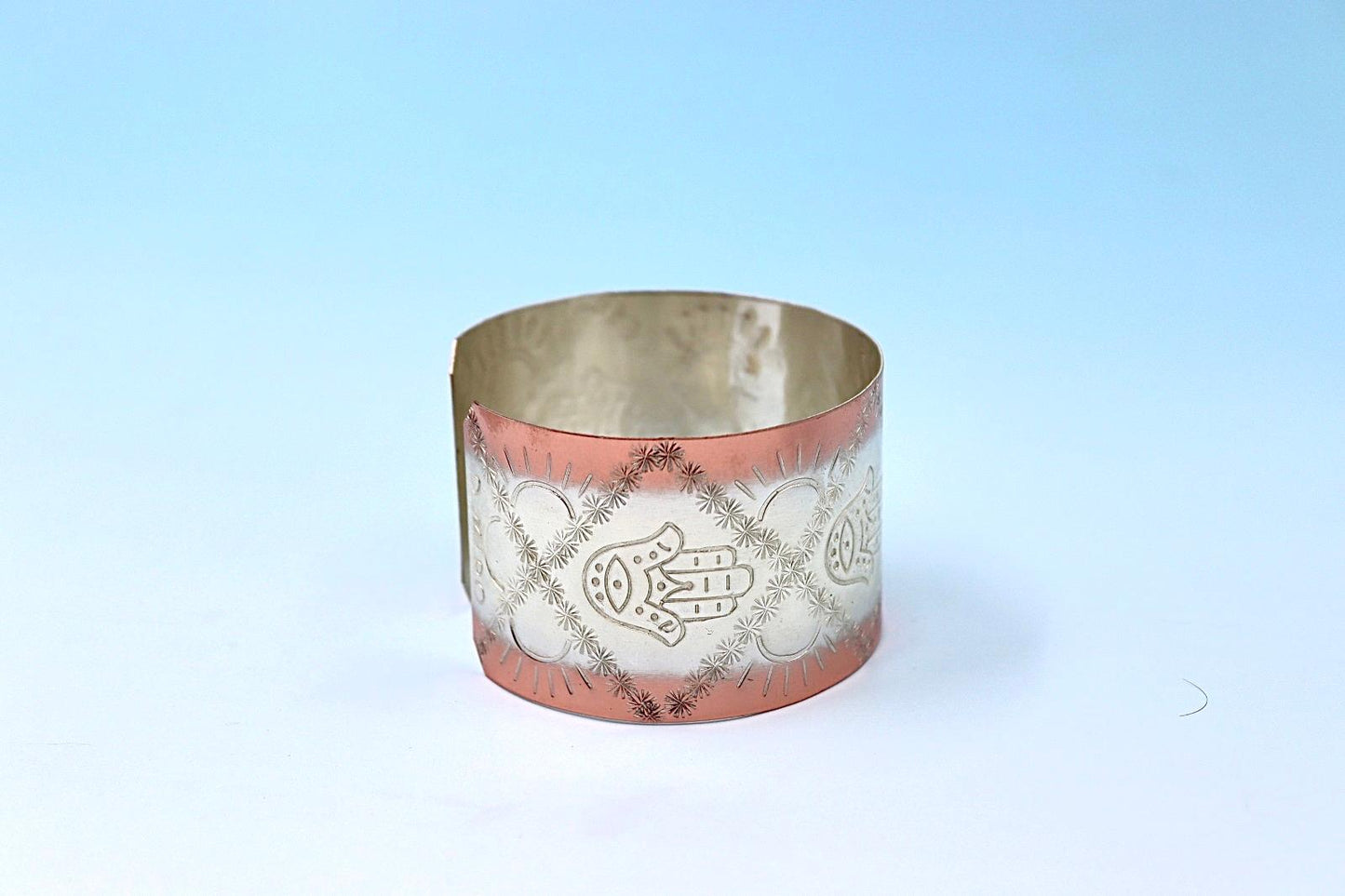 copper bracelet with Hamsa, partly silver plated.