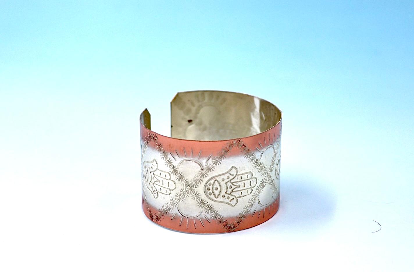 copper bracelet with Hamsa, partly silver plated.