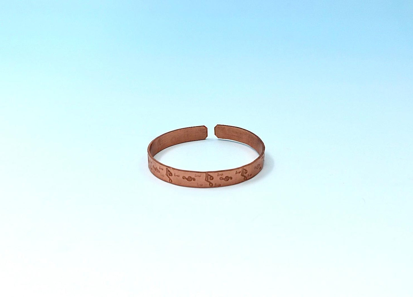 copper bracelet with music notes