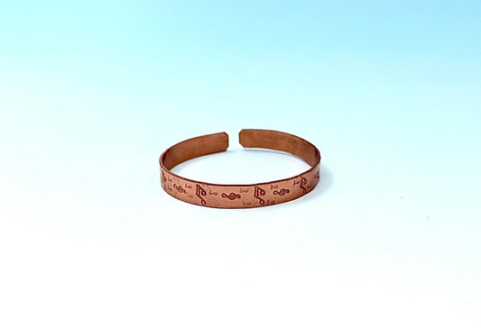 copper bracelet with music notes