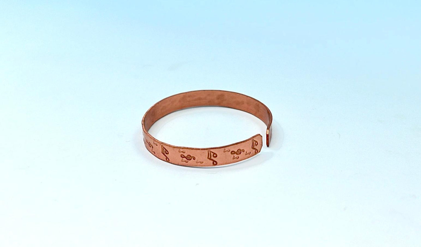 copper bracelet with music notes