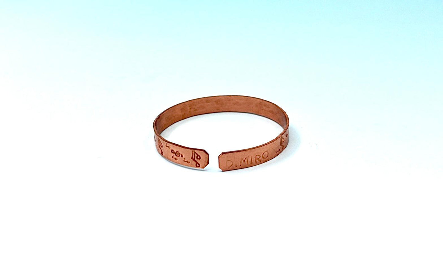 copper bracelet with music notes