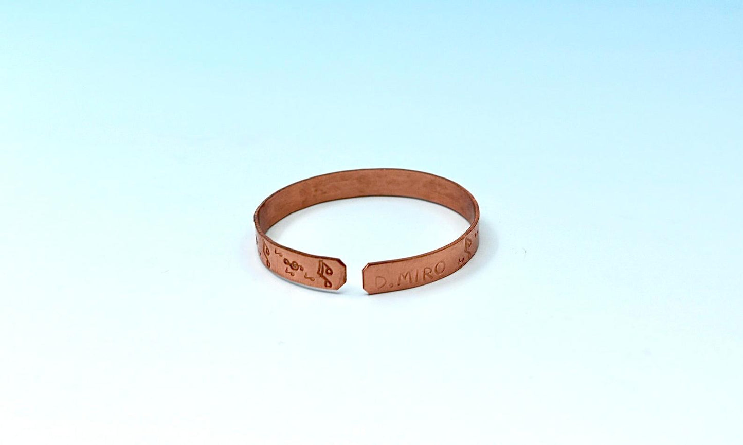 copper bracelet with music notes