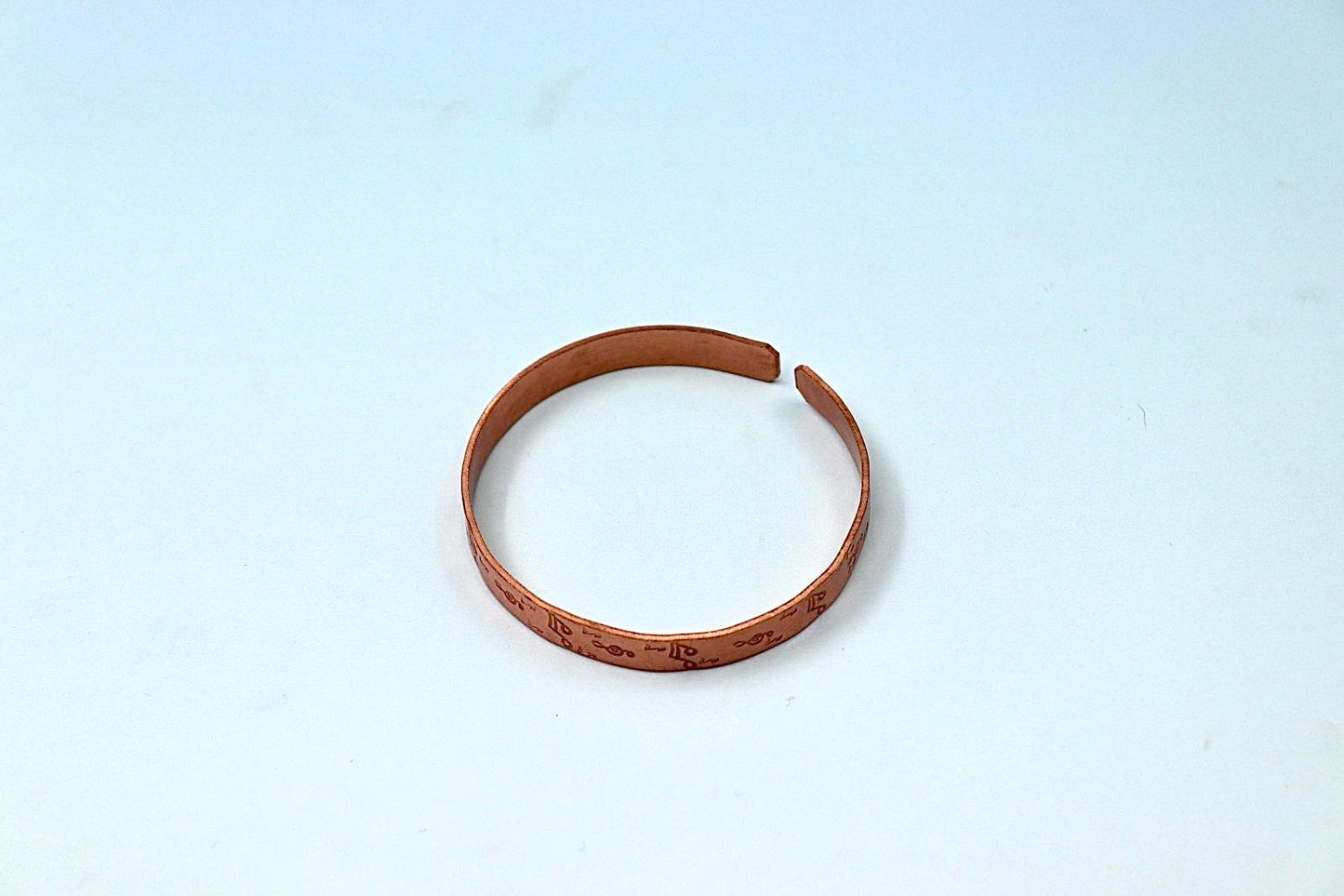 copper bracelet with music notes