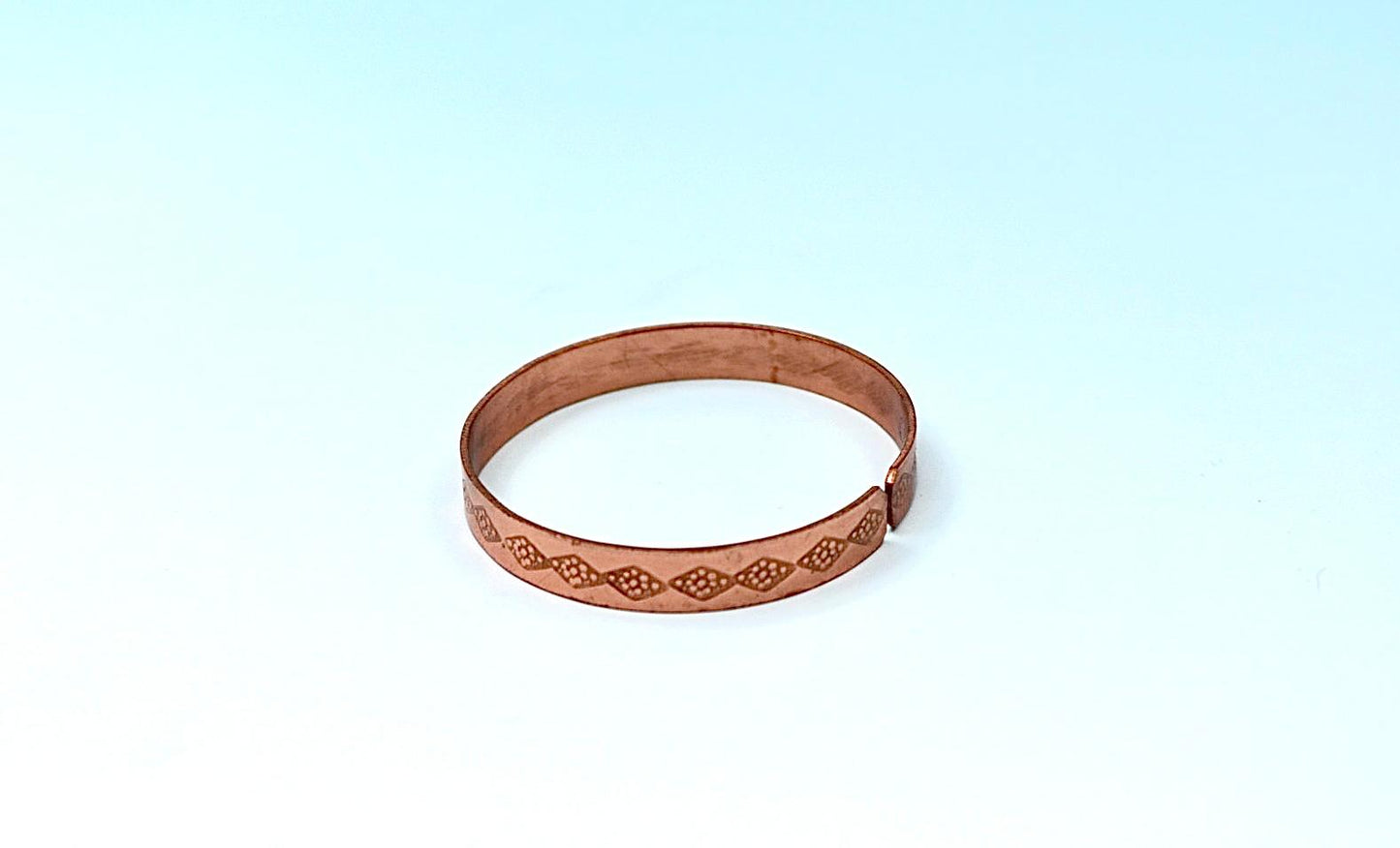 copper bracelet written:״LOVE ״ in Hebrew