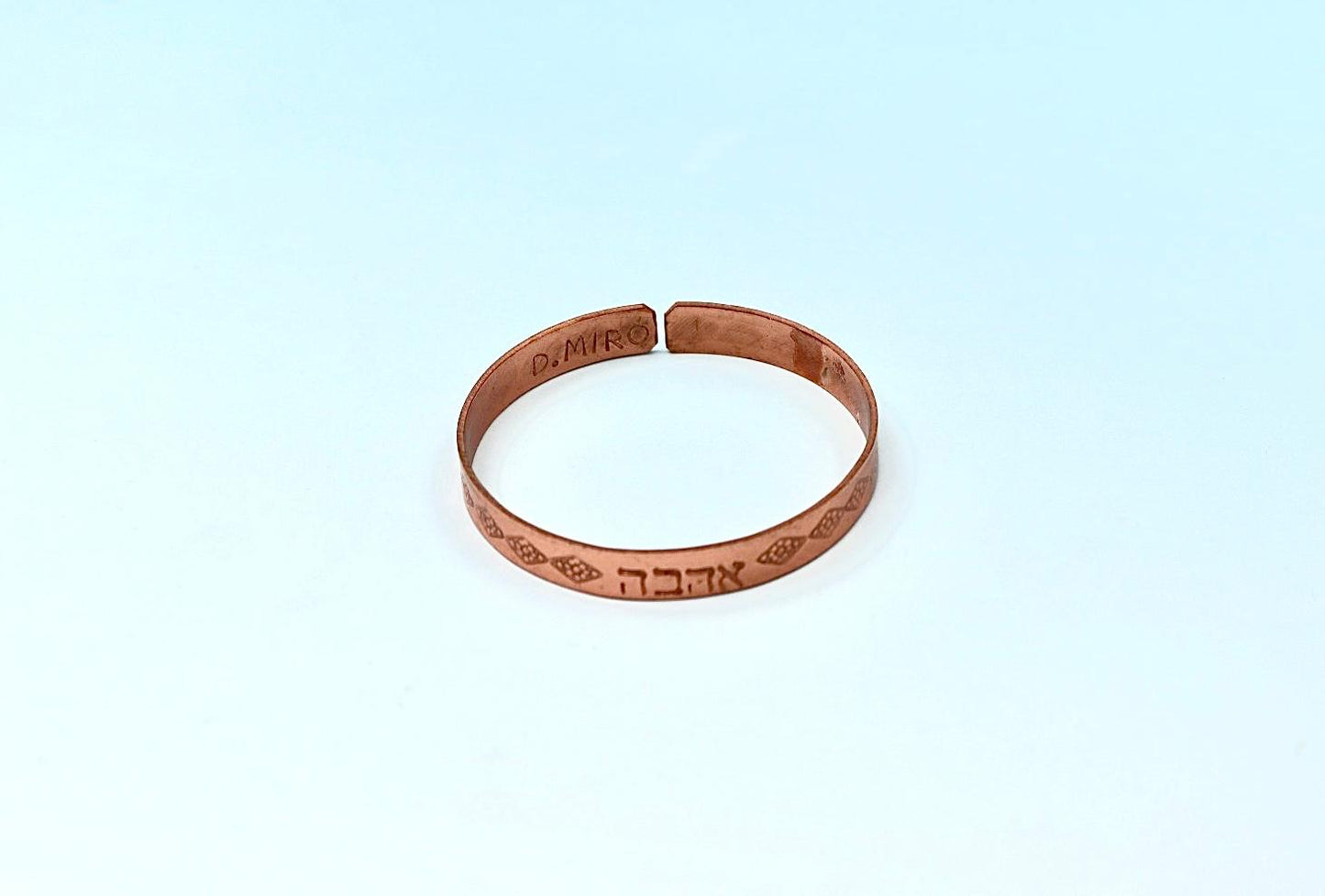 copper bracelet written:״LOVE ״ in Hebrew