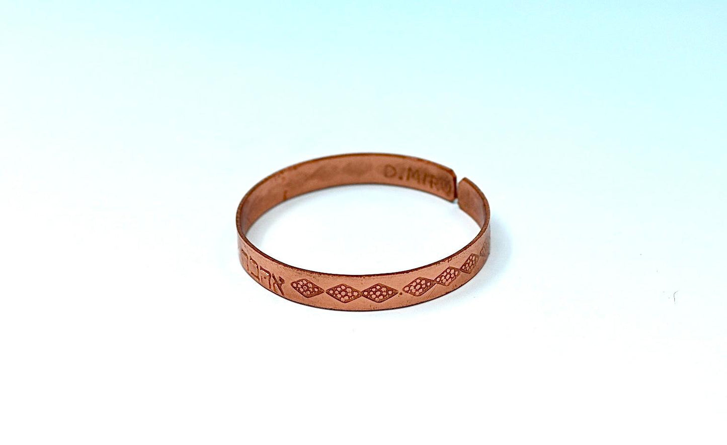 copper bracelet written:״LOVE ״ in Hebrew