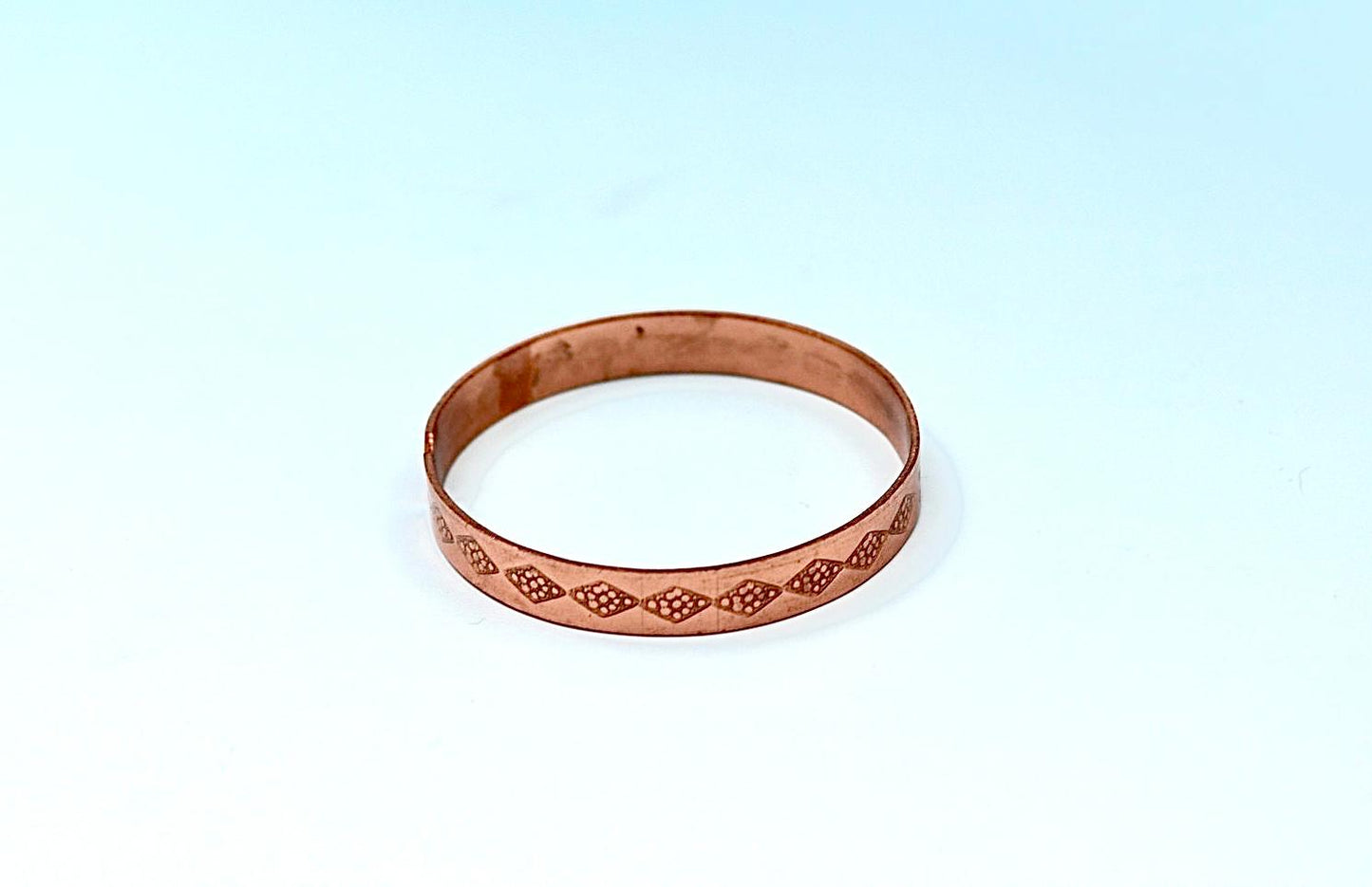 copper bracelet written:״LOVE ״ in Hebrew