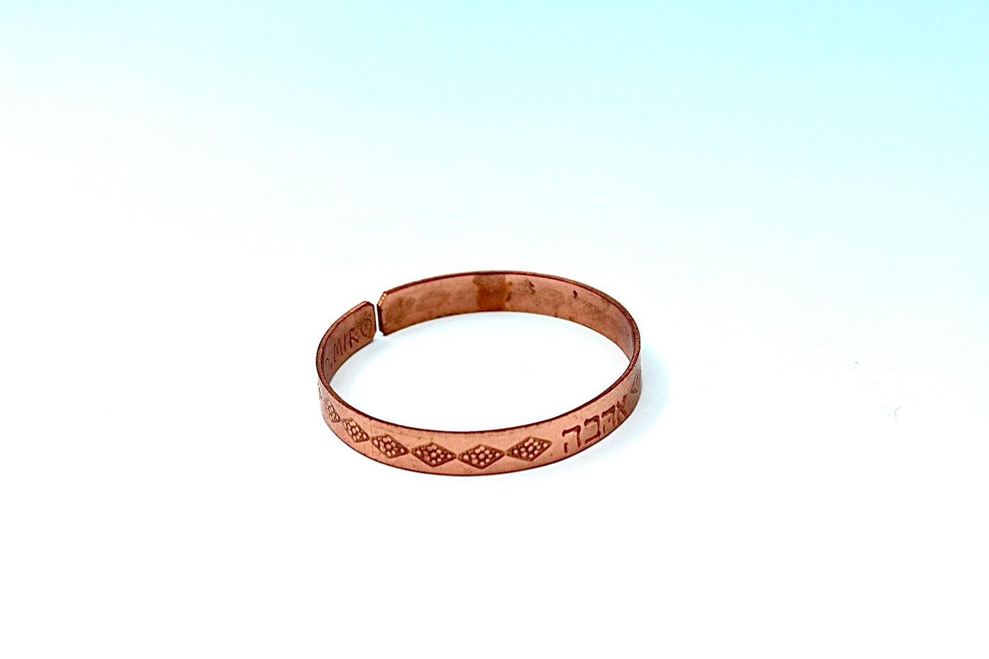 copper bracelet written:״LOVE ״ in Hebrew