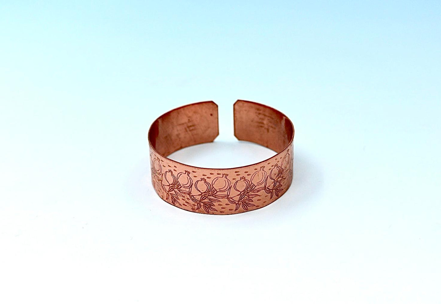 copper bracelet engraved with pomegranates