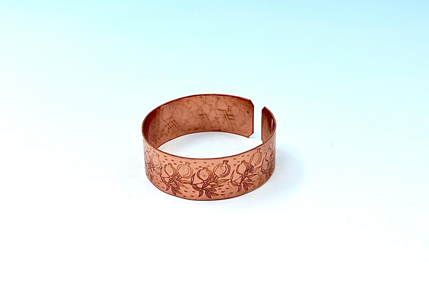 copper bracelet engraved with pomegranates