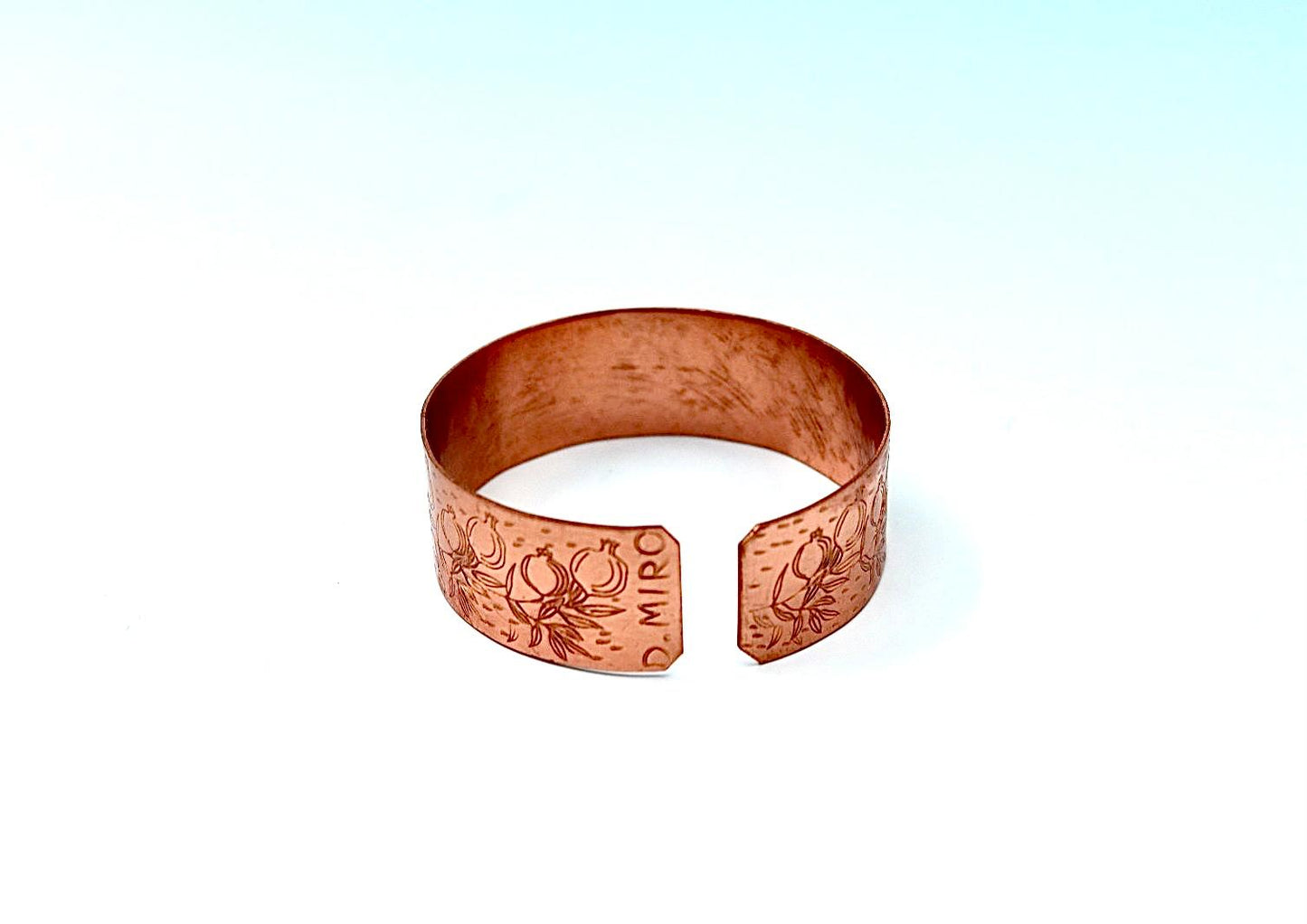 copper bracelet engraved with pomegranates