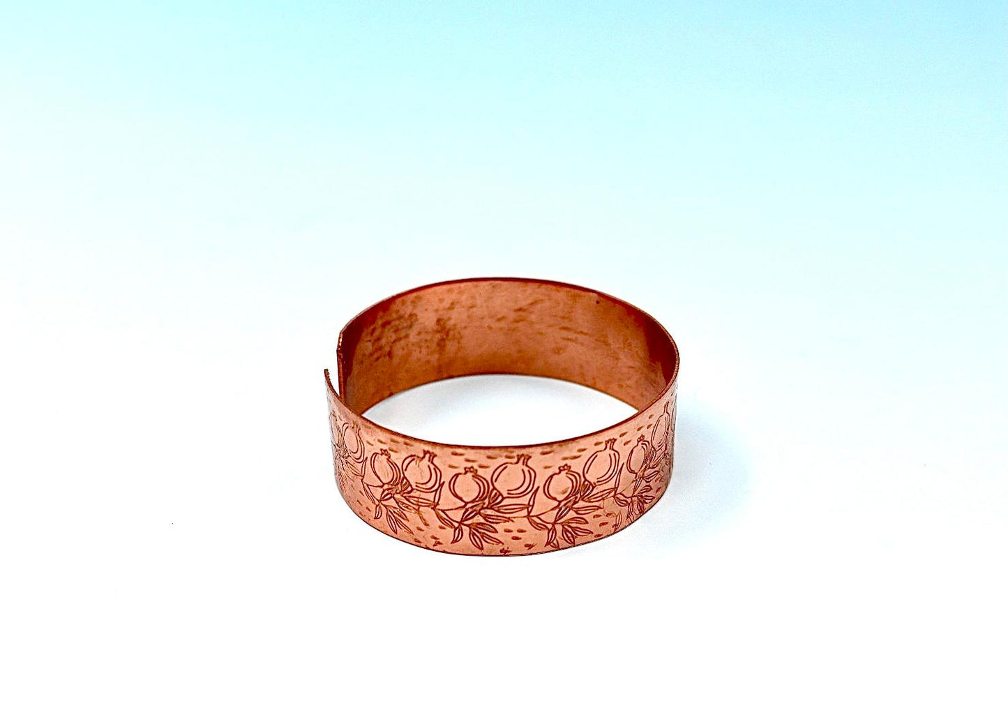 copper bracelet engraved with pomegranates