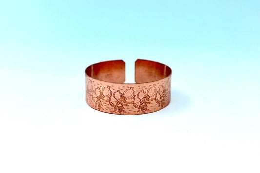 copper bracelet engraved with pomegranates