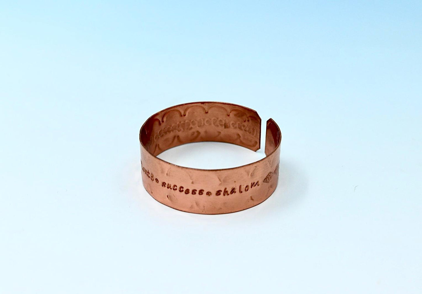 copper bracelet engraved with  seven blessings.