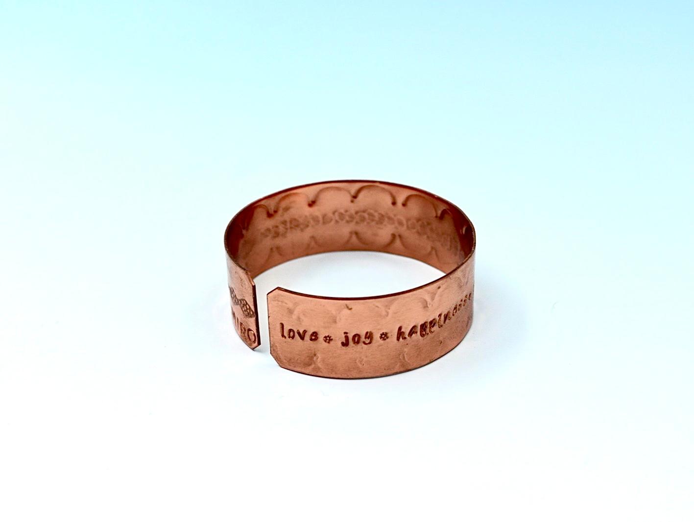 copper bracelet engraved with  seven blessings.