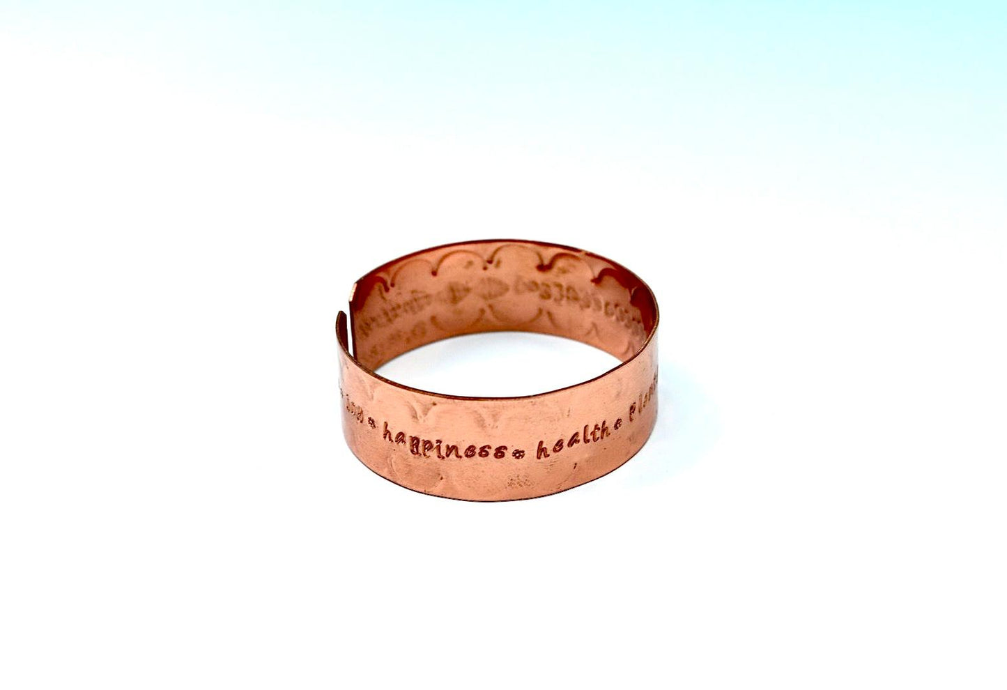 copper bracelet engraved with  seven blessings.