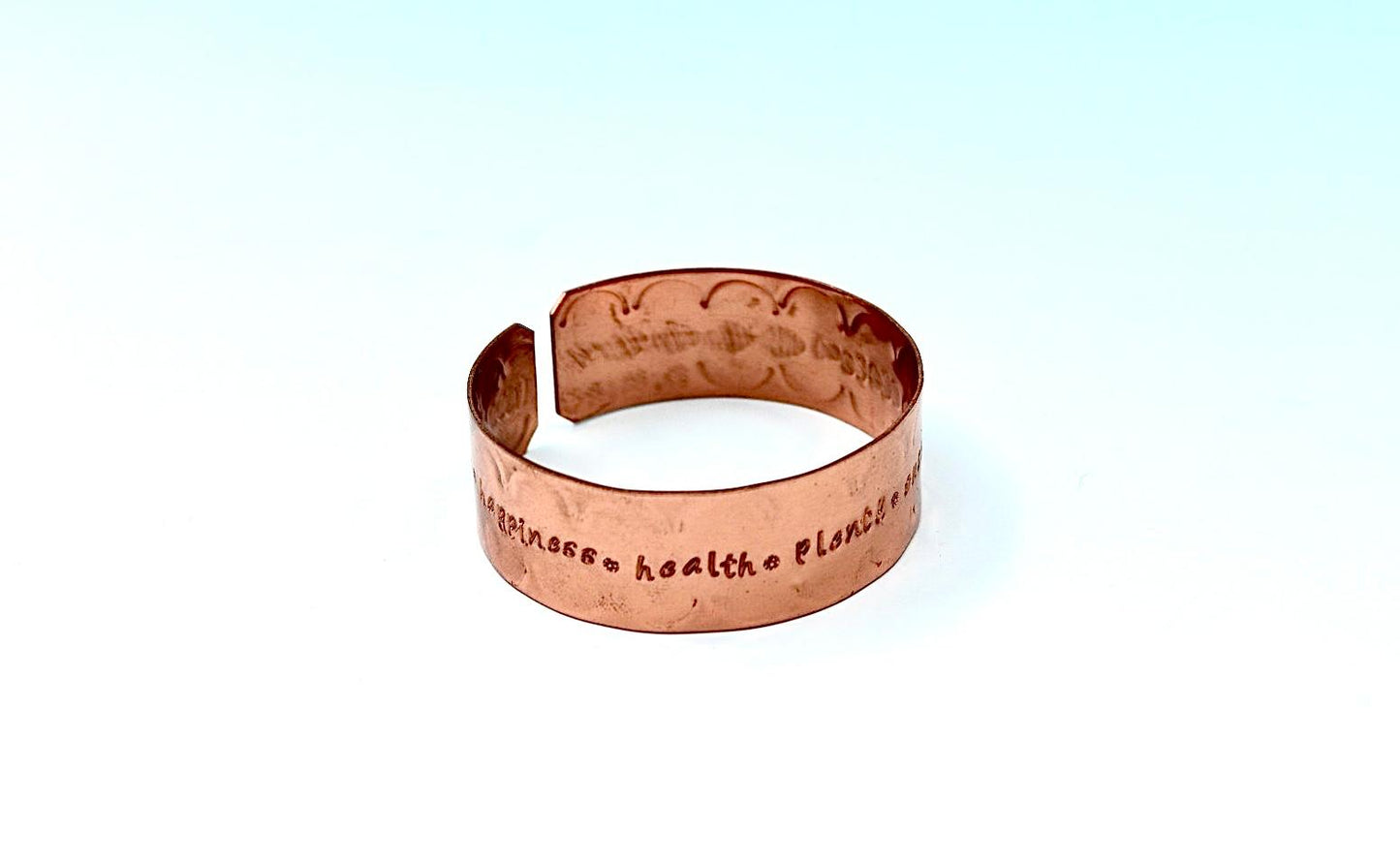 copper bracelet engraved with  seven blessings.