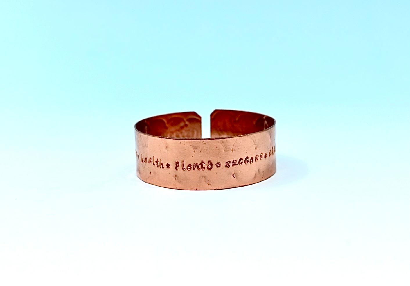 copper bracelet engraved with  seven blessings.