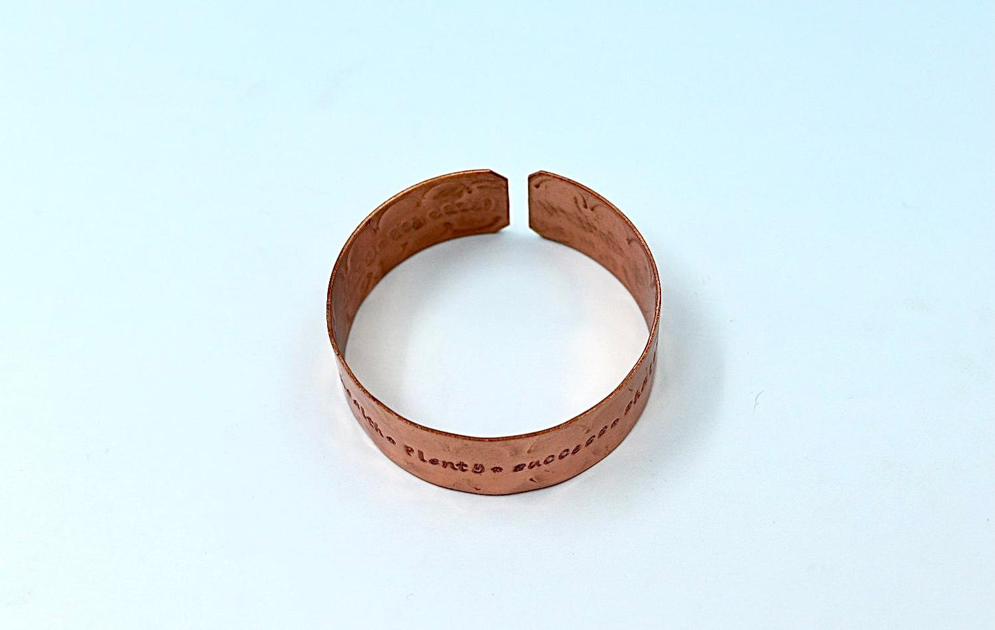 copper bracelet engraved with  seven blessings.