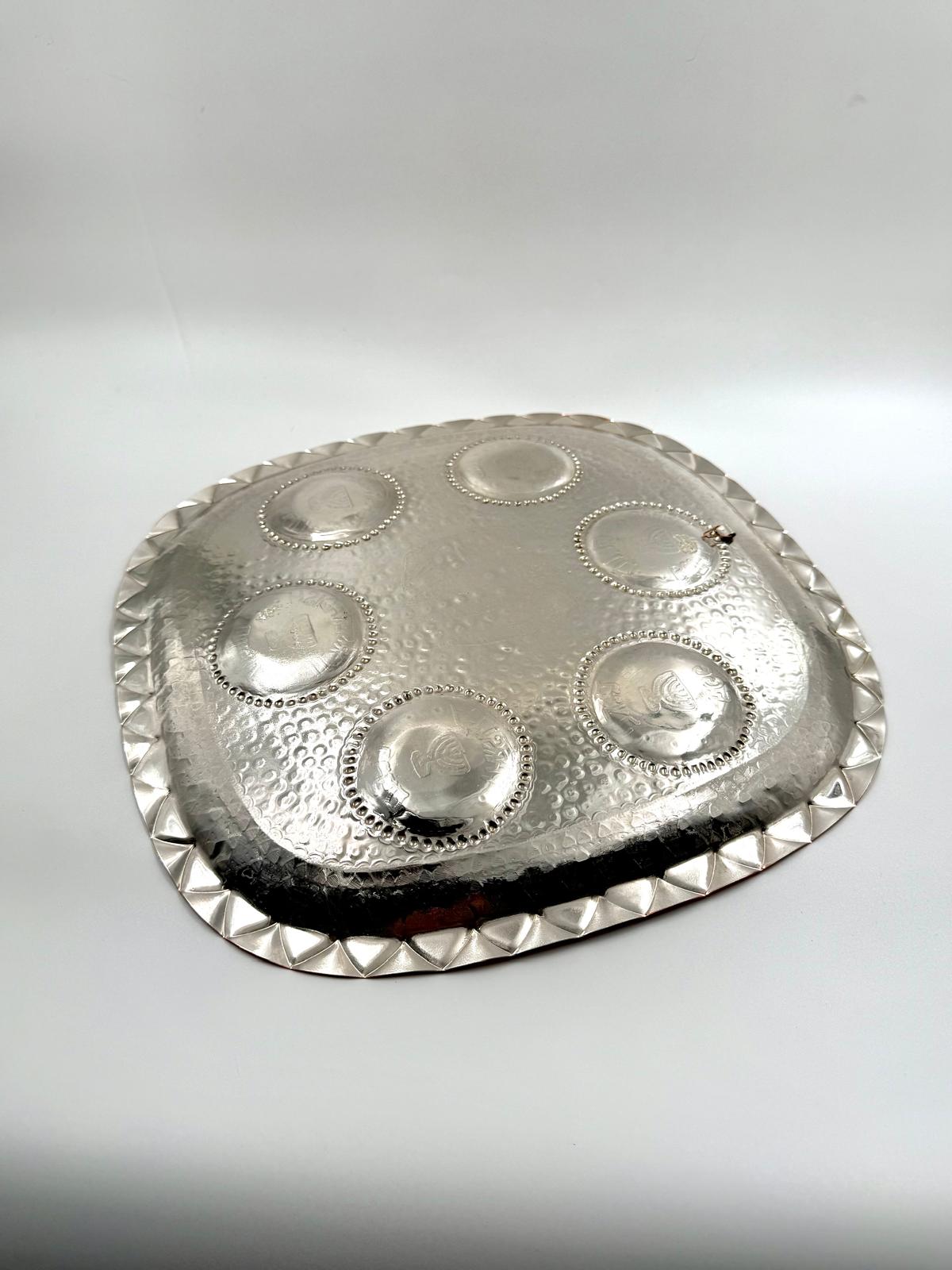 A unique handmade copper and silver Passover plate by David Miro