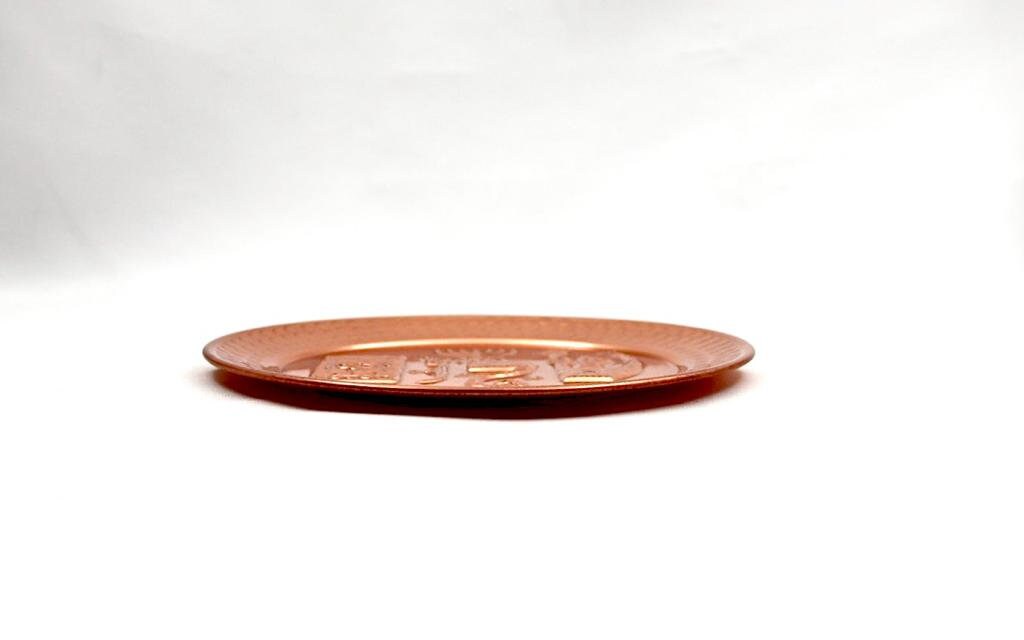 copper plate with the word SHALOM