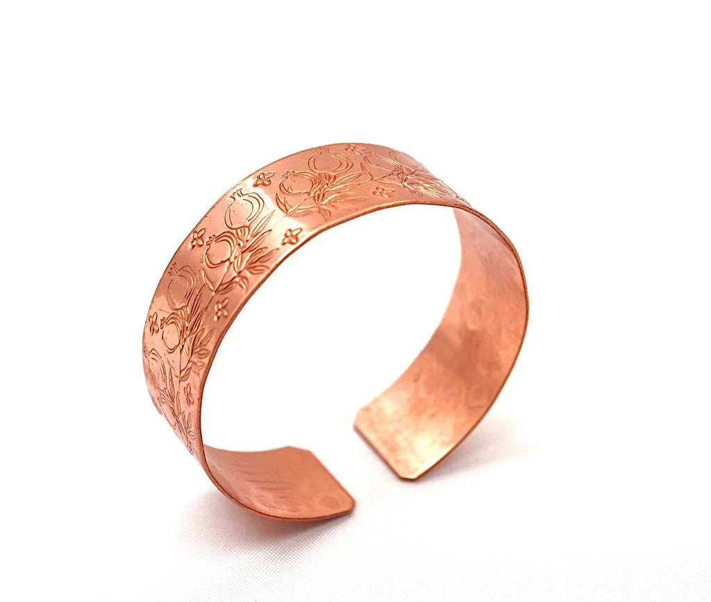 Handmade copper bracelet engraved with pomegranates