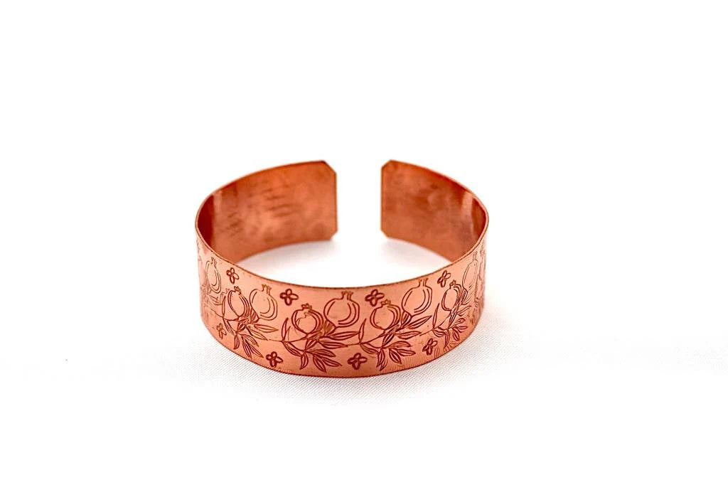 Handmade copper bracelet engraved with pomegranates