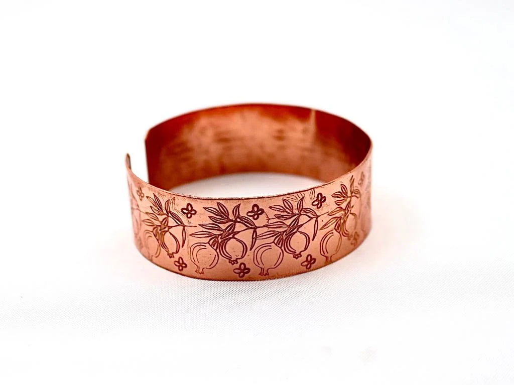 Handmade copper bracelet engraved with pomegranates