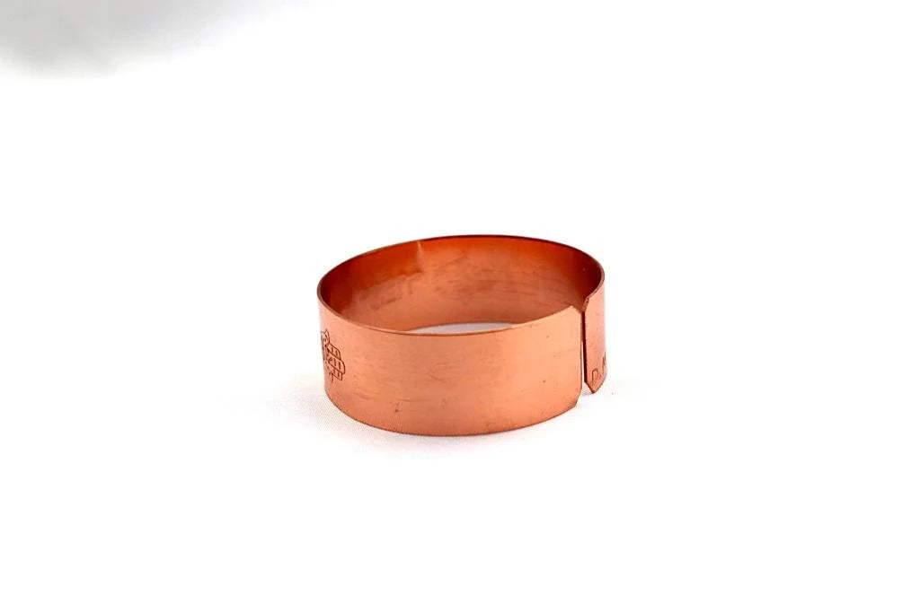 copper bracelet engraved :"This too shall pass" in Hebrew