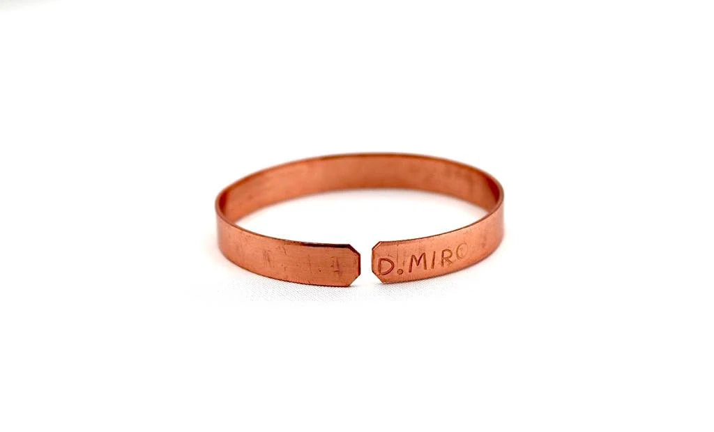 copper bracelet engraved "and in whatsoever he doeth he shall prosper" in Hebrew.