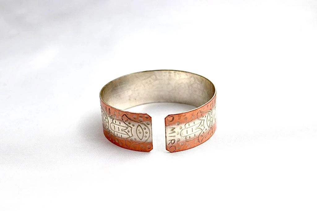 copper bracelet with Hamsa and the word Hay (Life)