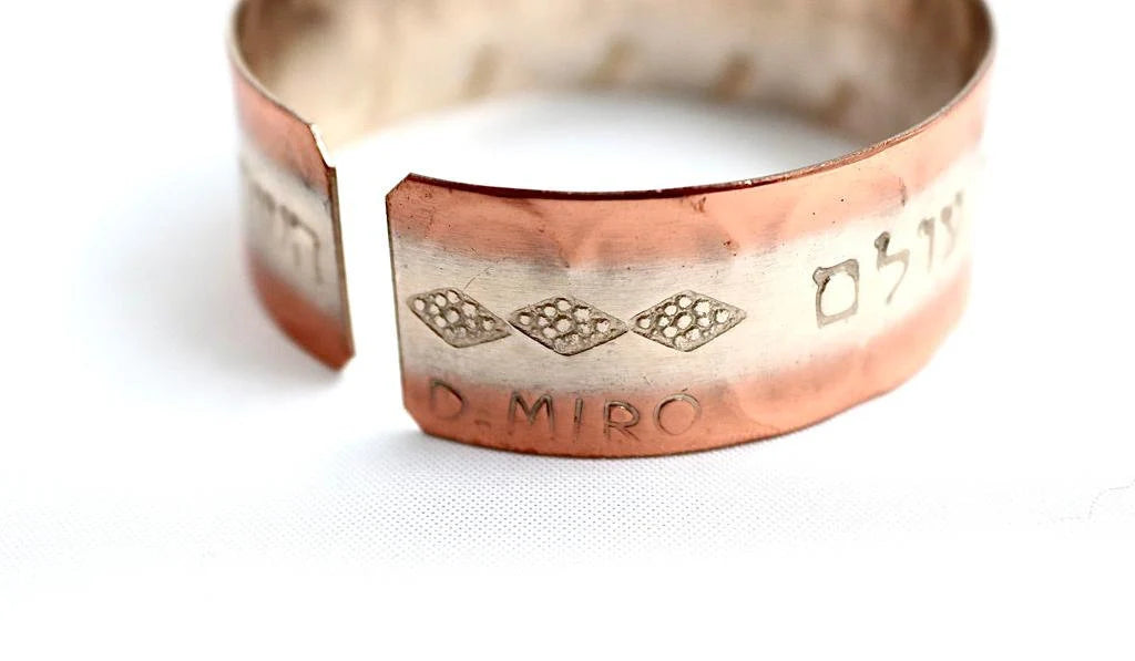 copper bracelet with the "Travelers prayer"