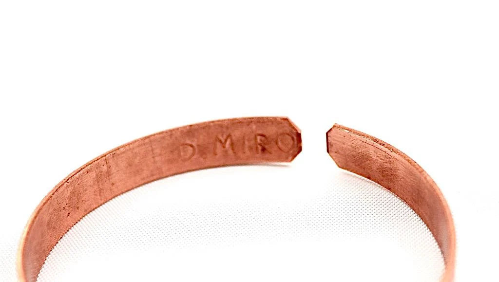 copper bracelet written:״LOVE ״ in Hebrew