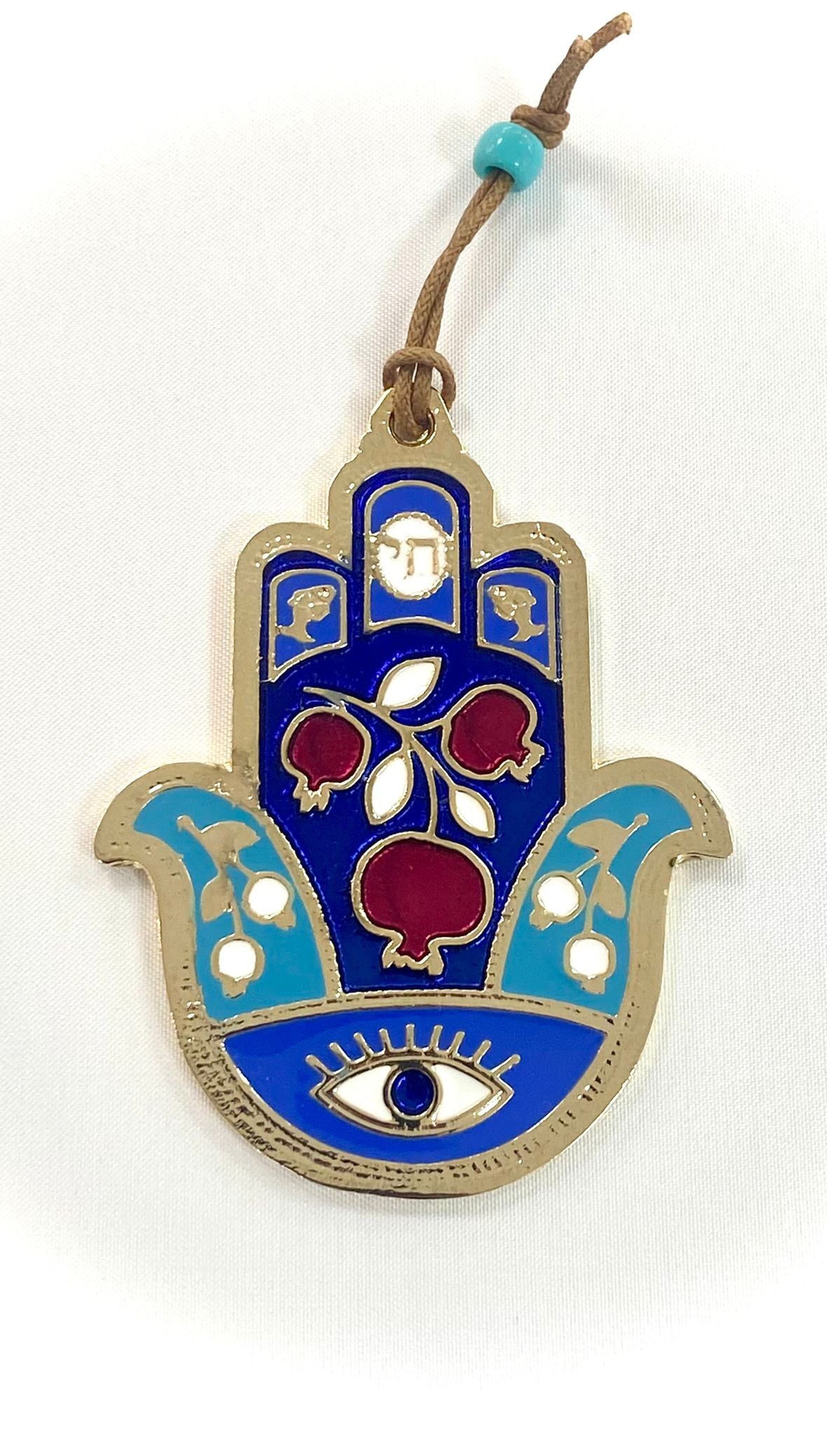 Hamsa designed with pomegranate and an eye against the evil eye